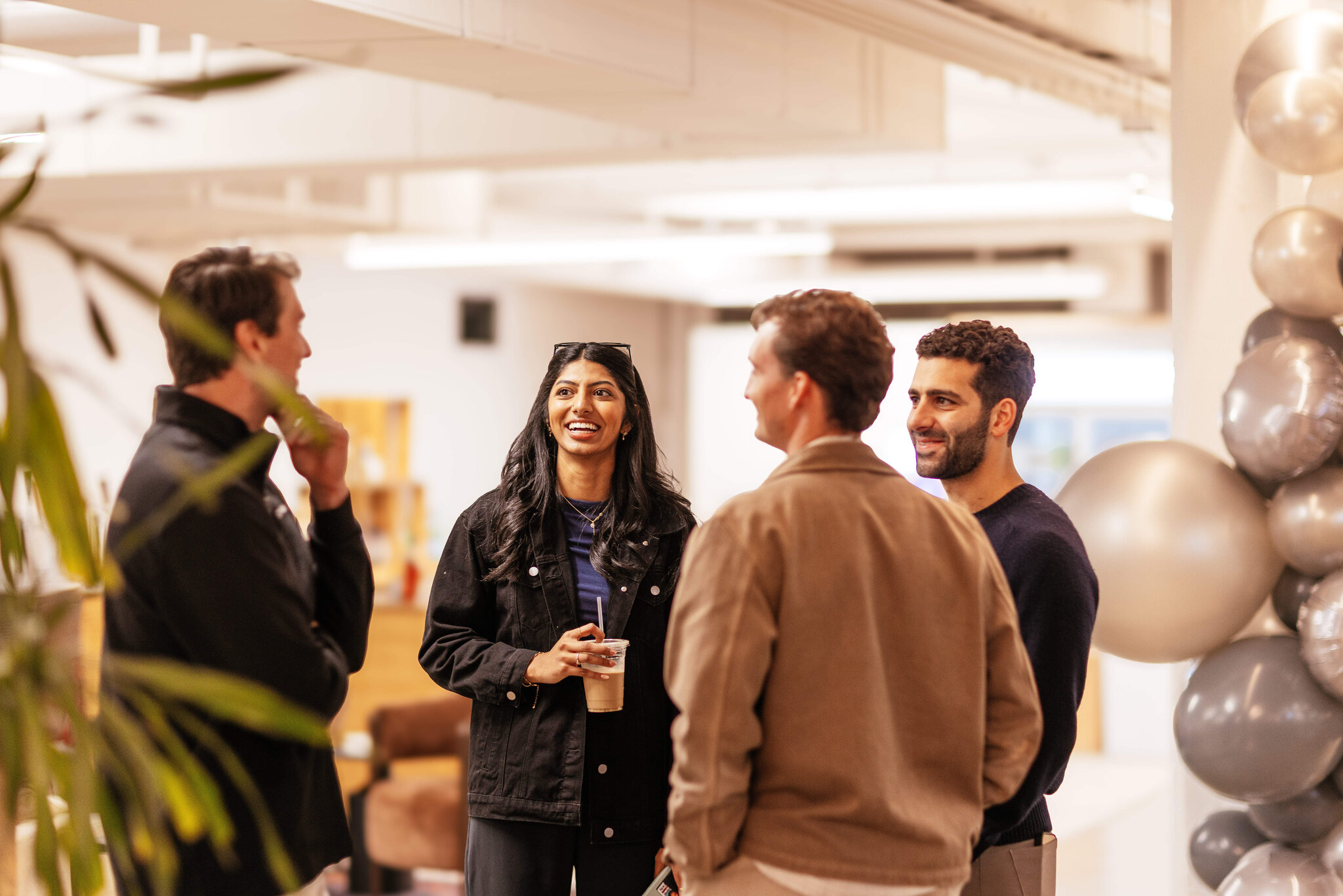 Cognition team members chatting at party