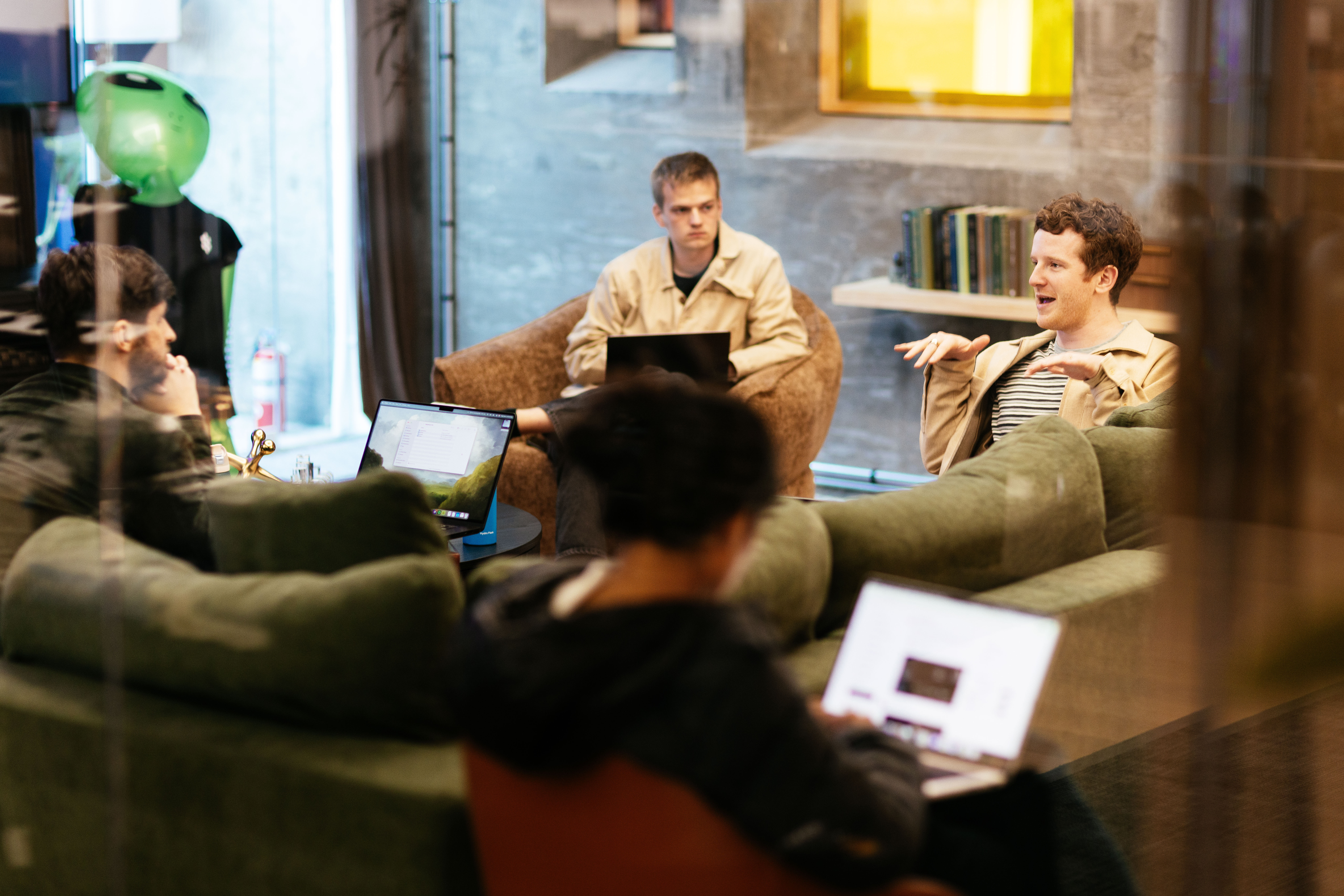 Cognition team working together on laptops